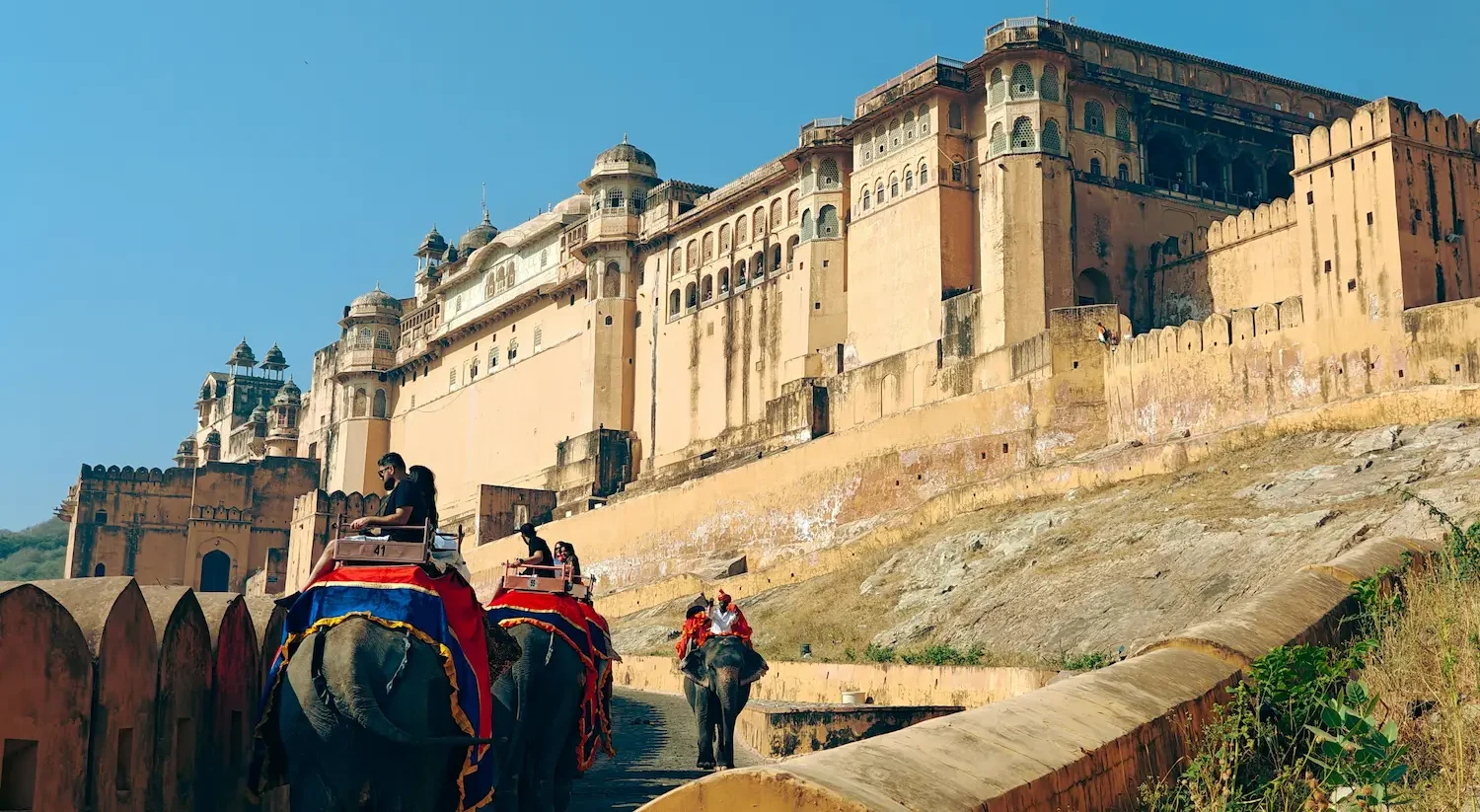 Sunrise view of the majestic yellow sandstone walls and courtyards of Amber Fort in Jaipur